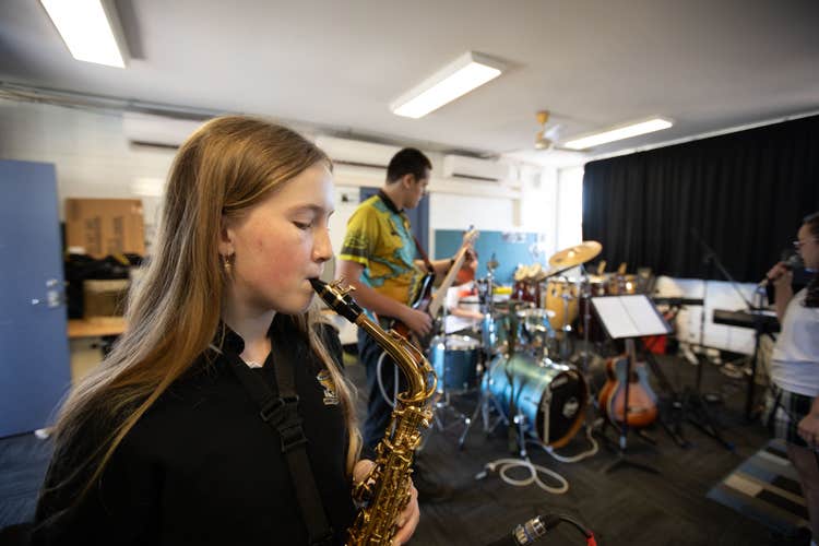 Student playing in a band