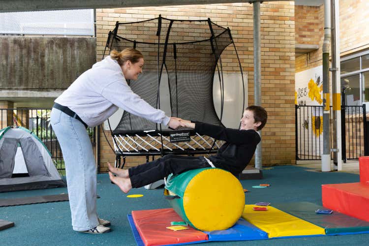 Special Ed student and teacher exercising