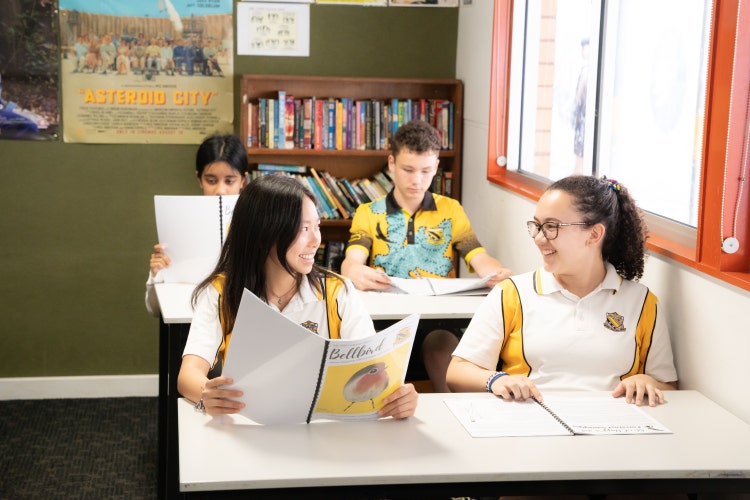 Student reading Bellbird, the school magazine