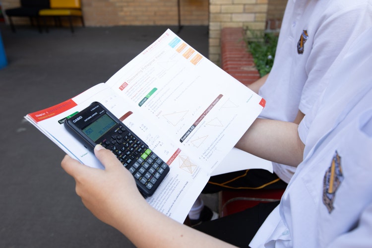 Students doing math with a calculator